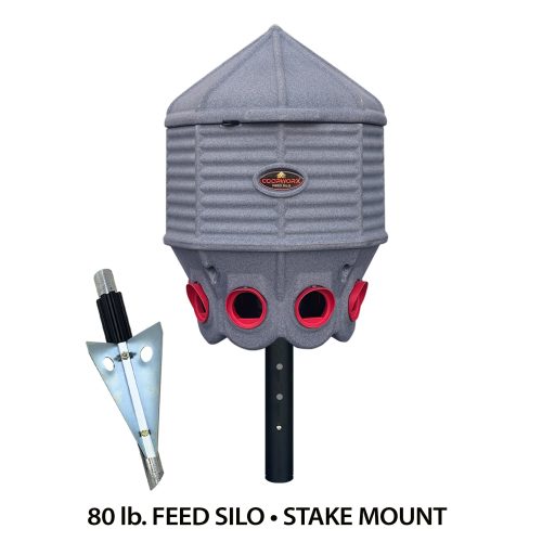 Hatching Time Coopworx 80 lb feeder silo can be seen in image with attached Stake mount.